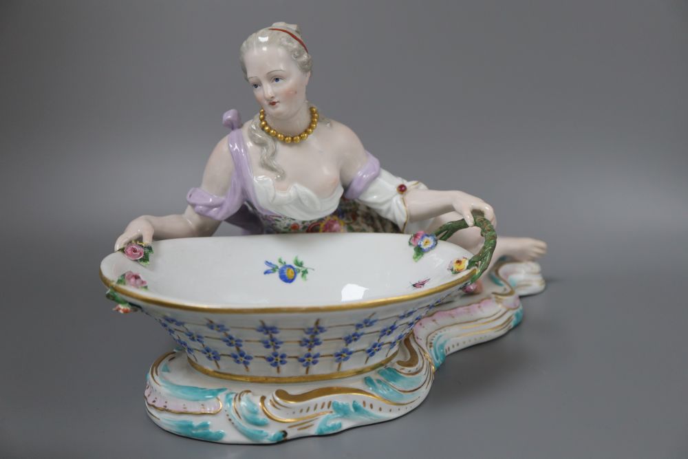 A pair of 19th century Meissen figural baskets, one numbered 2863, the other 2858